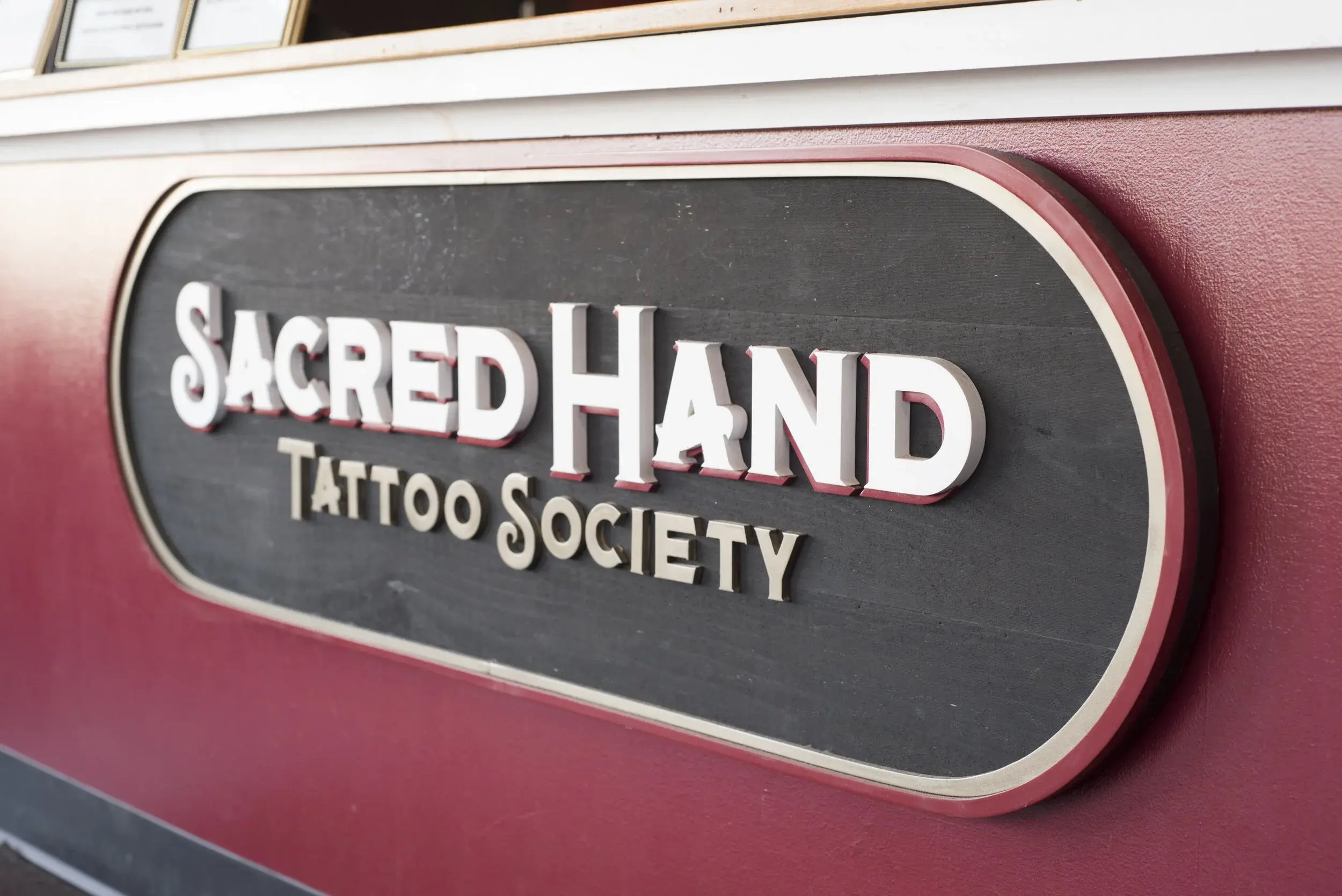 Sacred Hand Tattoo Society Welcome Sign