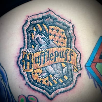 harry potter tattoos - hufflepuff patch tattoo