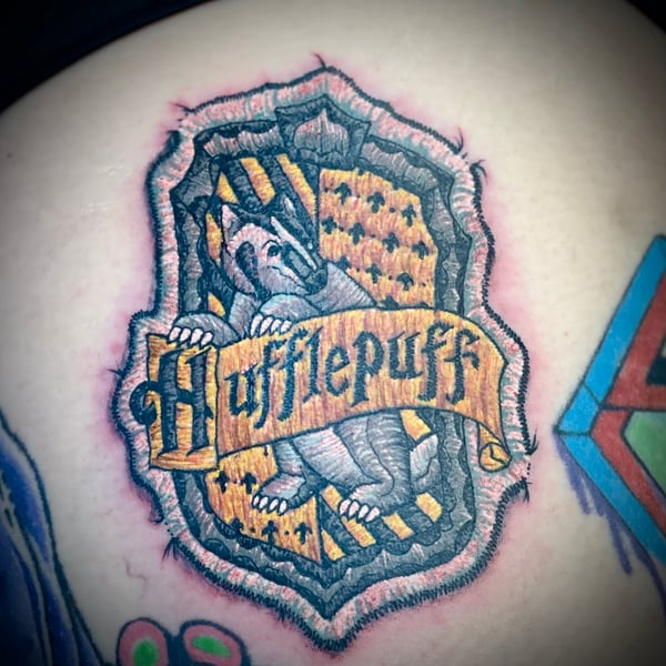 harry potter tattoos - hufflepuff house patch tattoo