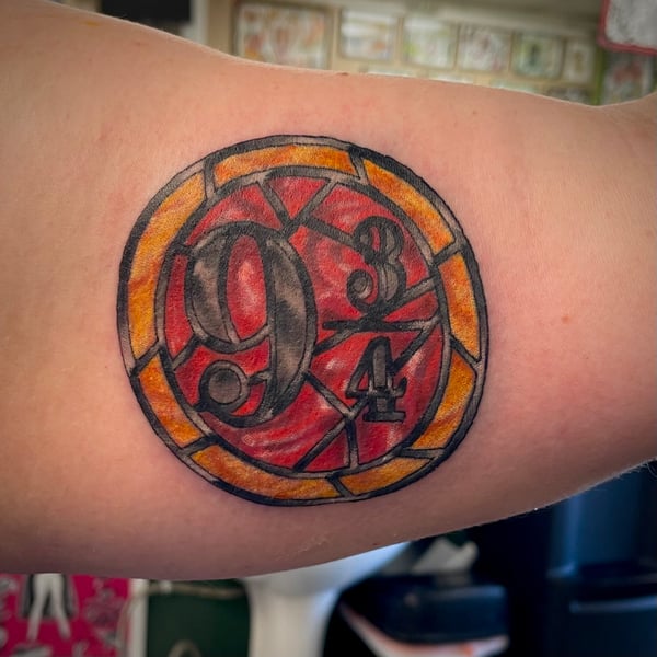 harry potter tattoos - platform 9 and 3 quarters staind glass tattoo